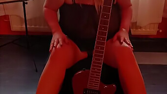 A Blonde With Big Tits Plays Guitar And Pleasures Herself